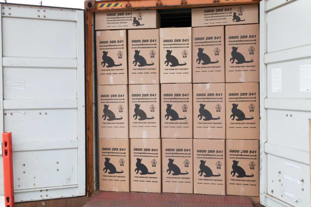 Doree Bonner boxes in a shipping container