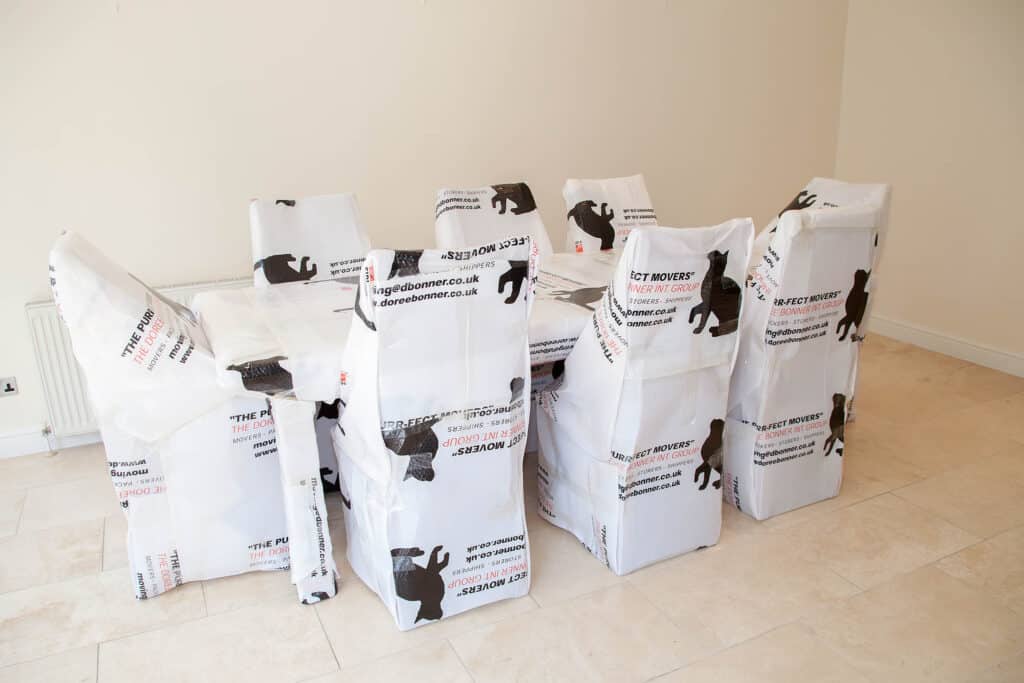 Table and chairs wrapped in DBI protective wrapping