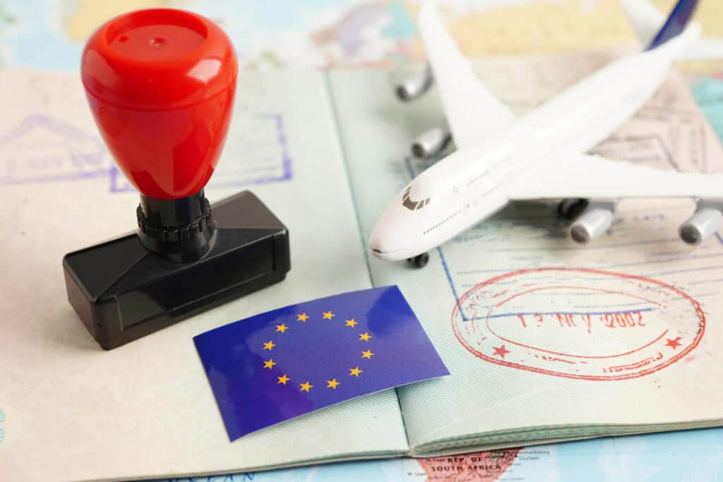 Plane, European flag and passport